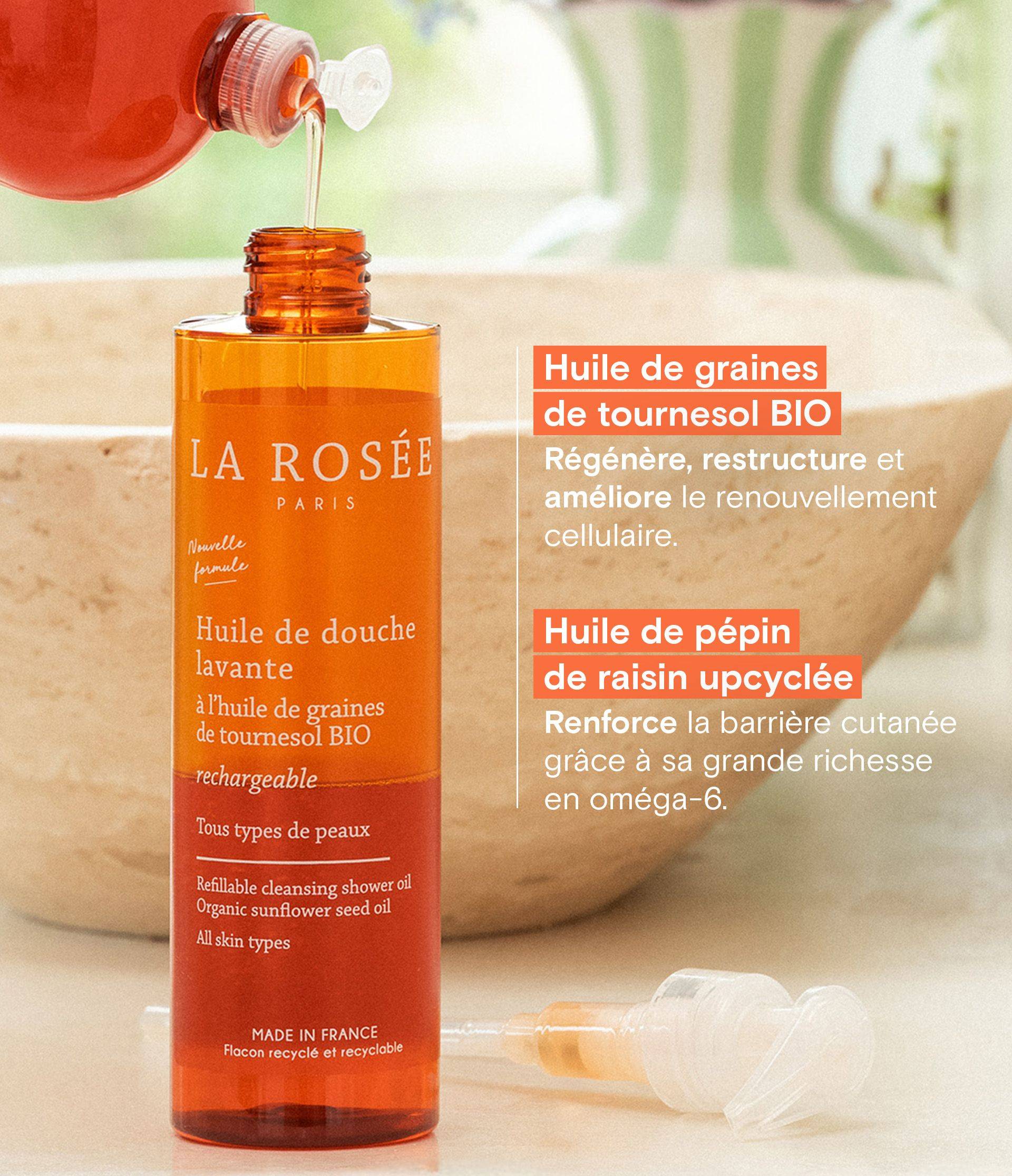 Orange bottle of La Rosée shower oil being refilled, promoting organic sunflower seed and upcycled grape seed oils for all skin types.